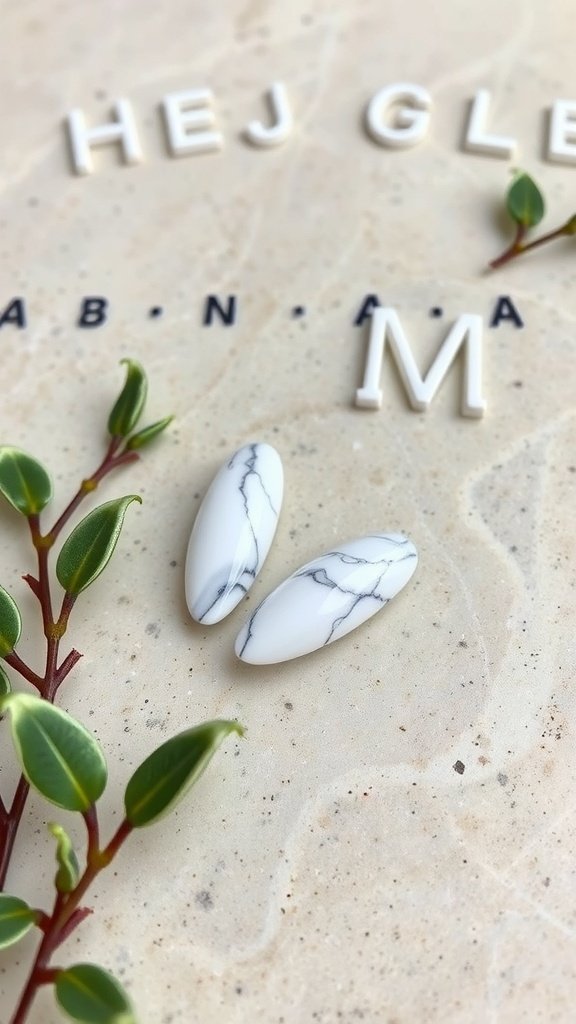 Short almond acrylic nails with a chic marble effect on a light background