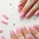 Collection of pink square acrylic nails in various shades and designs