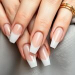 Elegant classy acrylic nails featuring neutral colors and minimal design elements