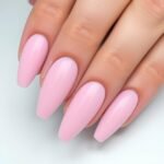 Soft pastel pink acrylic nails with almond shape