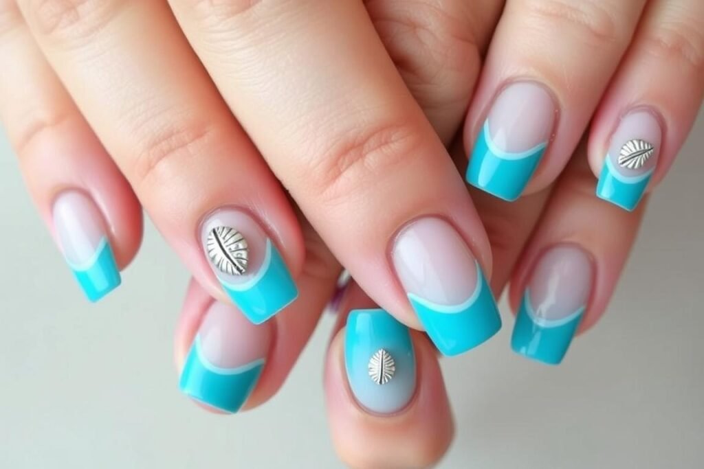 Blue beach French tip nails with turquoise tips and subtle shell accents