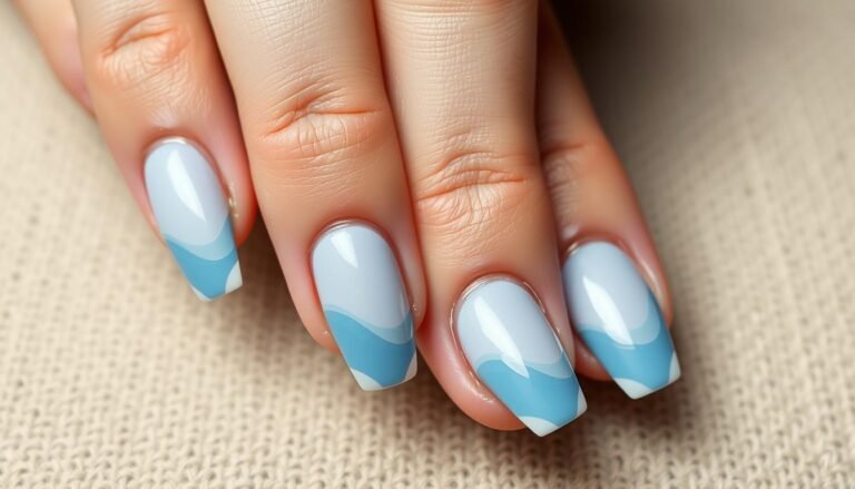 Elegant hands with classy beach nails featuring subtle wave designs in soft blue tones
