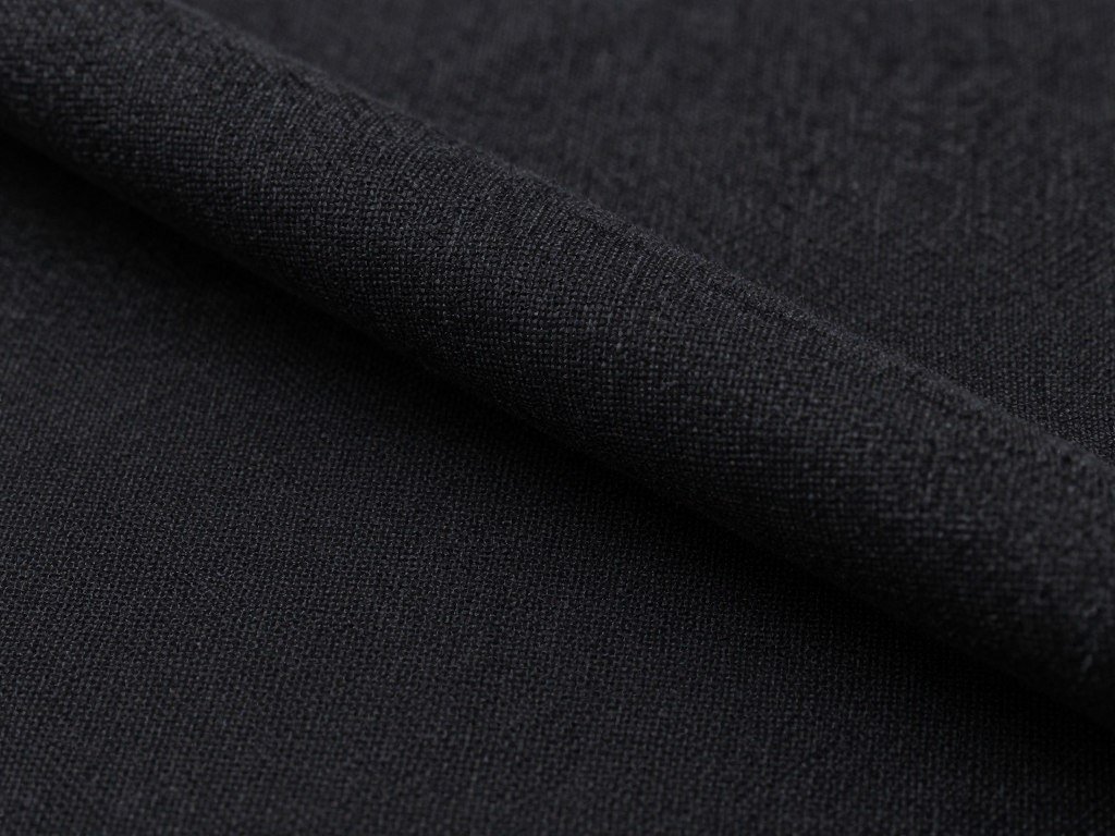 Close-up of black linen pants fabric texture showing the natural weave and breathable quality essential for a comfortable black linen pants outfit