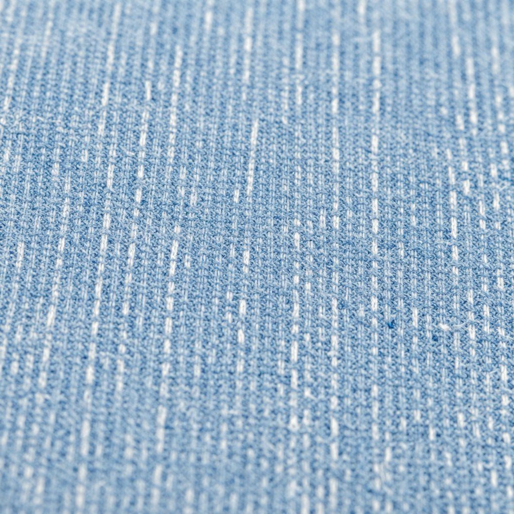 Close-up of chambray fabric texture for summer clothing