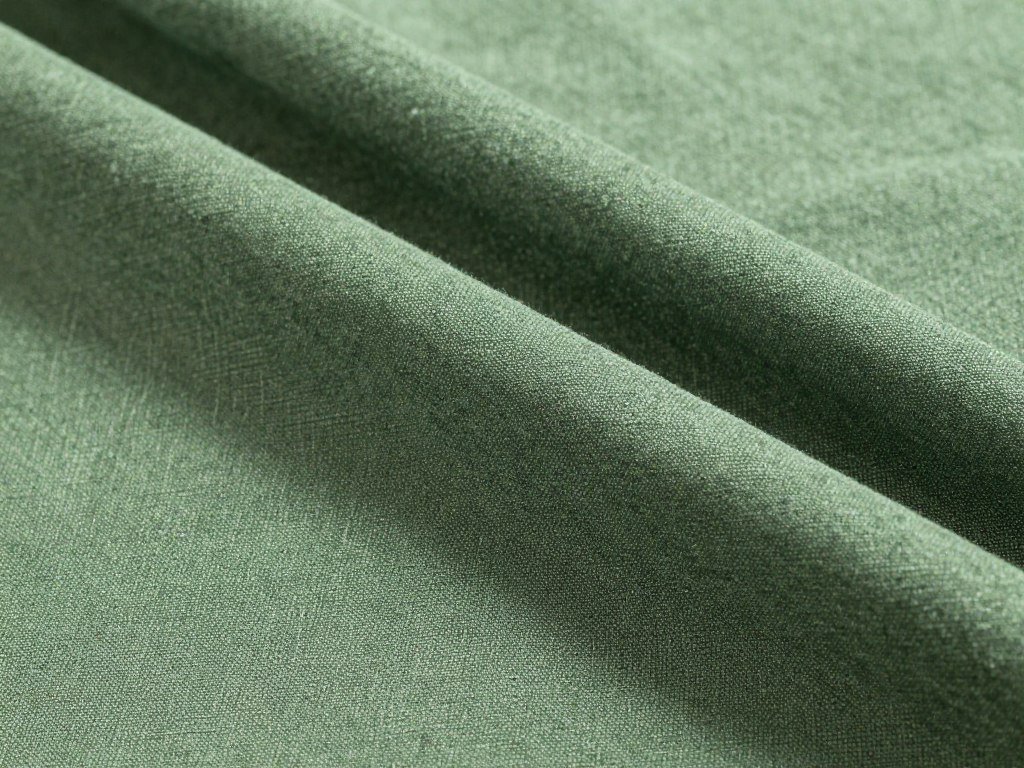 Close-up of properly cared for green linen pants showing texture and color