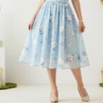 Woman in pastel Easter outfit with floral dress and accessories for spring celebration