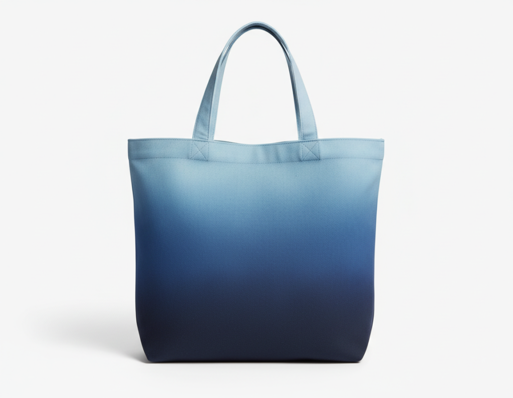 Canvas tote bag showing smooth ombre effect from navy to light blue
