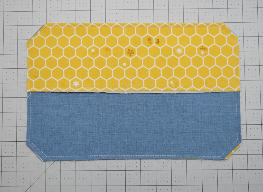 Trimmed corners and seam allowances on sewn fabric