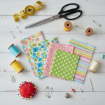 DIY Sewing Projects for Beginners: 28 Easy Ideas to Start Your Creative Journey Today colorful fabric pieces and basic sewing supplies arranged on a clean white workspace