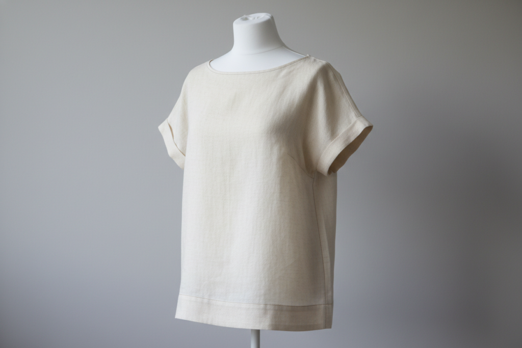 completed handmade women's top on dress form