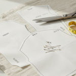 sewing easy diy top pattern layout on fabric with scissors and measuring tape