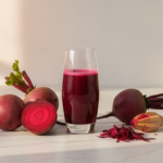 Fresh beetroot juice in glass with raw beetroot for glowing skin